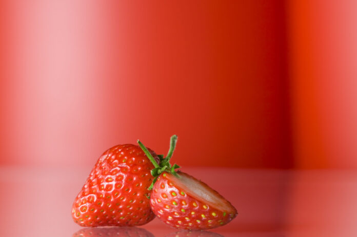 Close,Up,View,Of,Nice,Fresh,Red,Berry,On,Red